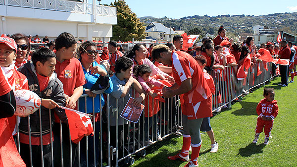 Ikale Tahi team signing autographs